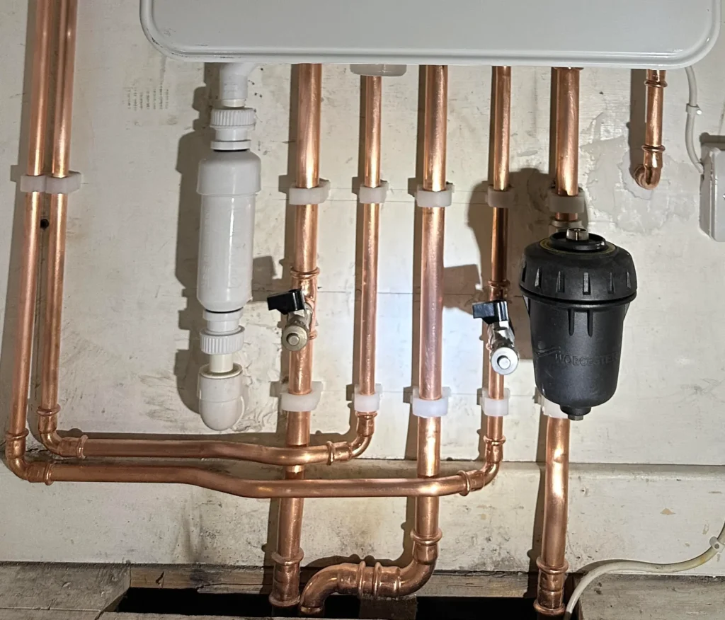 Thistle Boilers engineer replacing an old boiler with a new energy-efficient model
